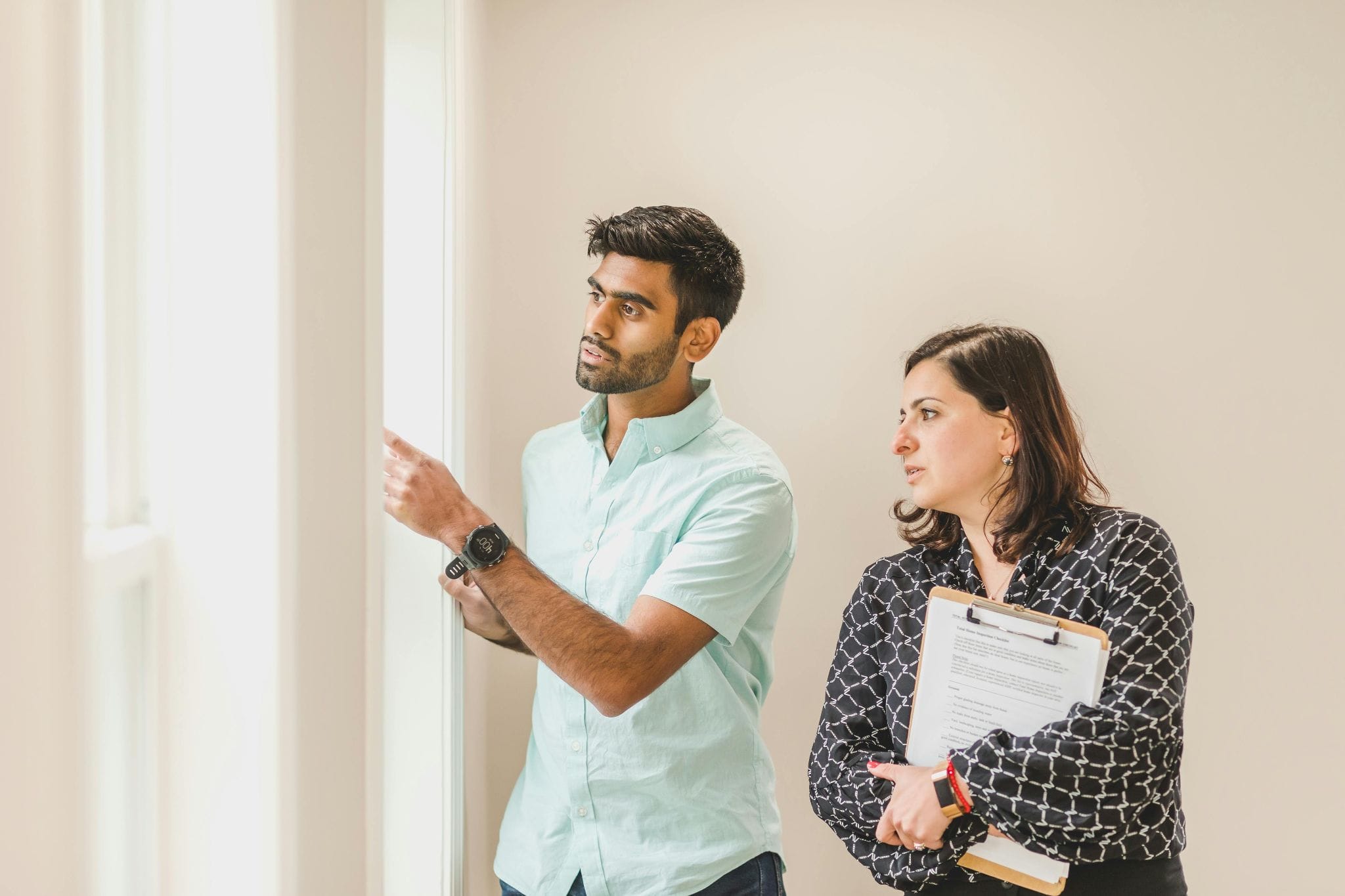 A tenant and property manager walking through a move-in inspection
